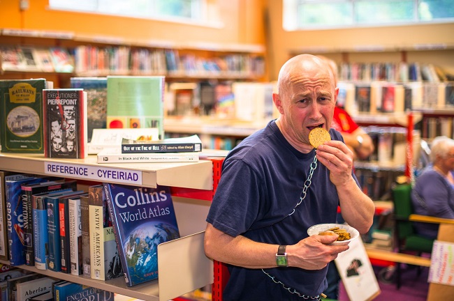 Angry protesters chain themselves to bookshelves in last ditch attempt to save library Angry protesters chain themselves to bookshelves in last ditch attempt to save library